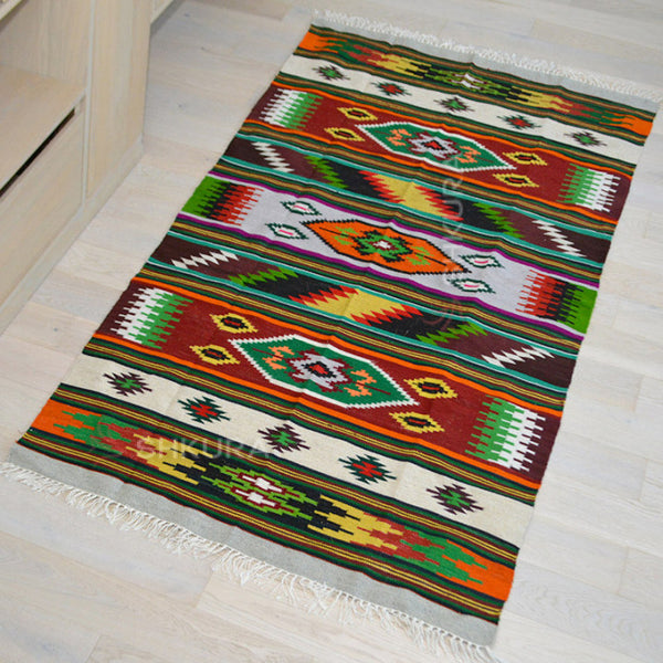 VyshnevaVolya handcrafted Ukrainian wool rug with traditional Ukrainian patterns and rich, vibrant colors.